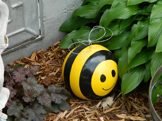 upcycling garden ideas art creative reuse bowling ball cute honey bee