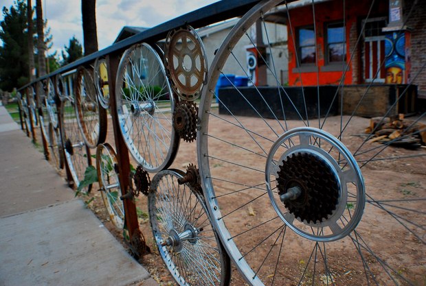 old bicycle wheels used as garden fence creative idea