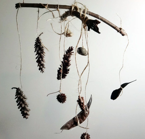 wind chime crafts decoration made of pine cones and wooden forest sticks
