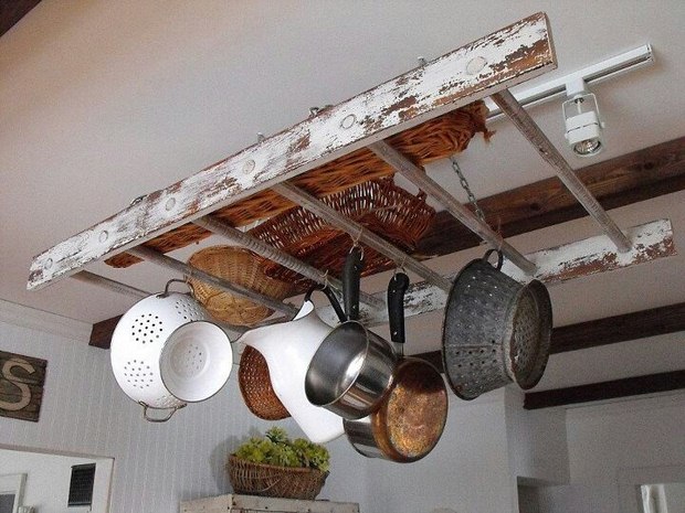repurposed vintage wooden rack ladder hanging from the ceiling in the kitchen