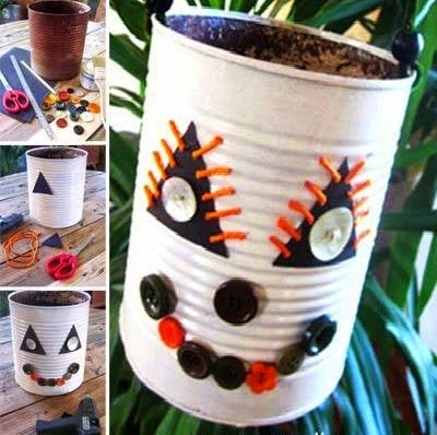diy halloween monster made of old tin can sewing buttons white painted creepy decorated