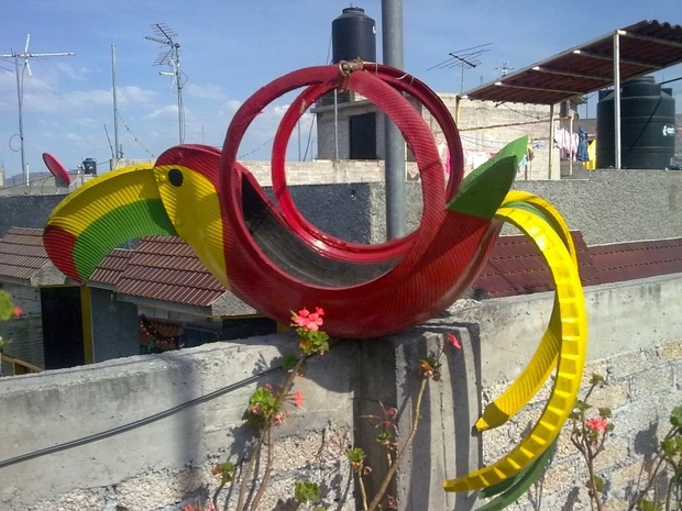 how to recycle old tires making garden colourful parrot tire planter of used rubber tires fence antennas in backyard