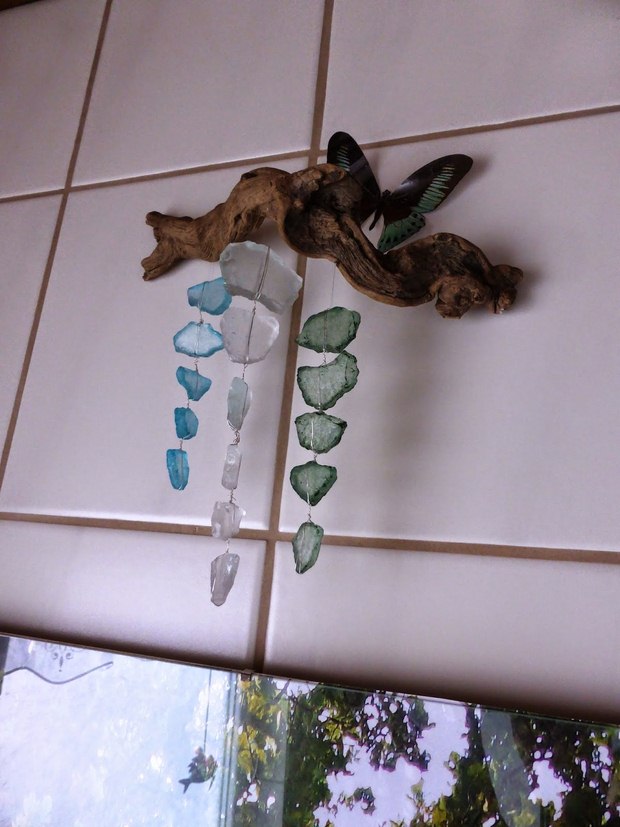 upcycled small glass pieces into diy wind chime home decoration